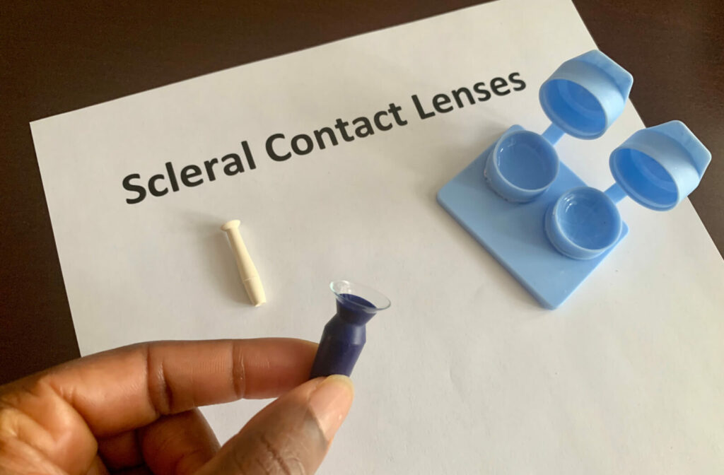 A contact lens case with scleral contacts and a contact lens insertion and removal kit.