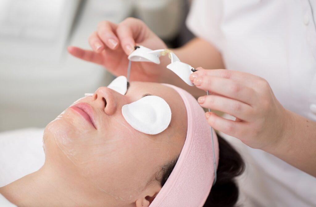 A woman is preparing for her ocular IPL treatment at her eye care professional's office