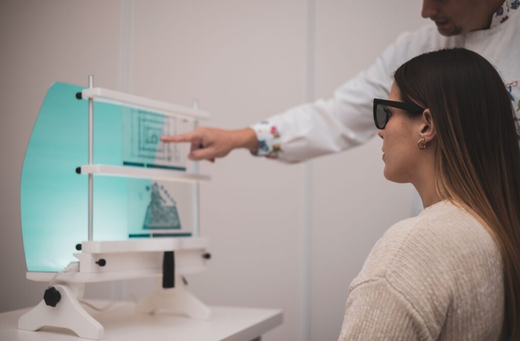 A female at the eye doctor for a vision therapy appointment.