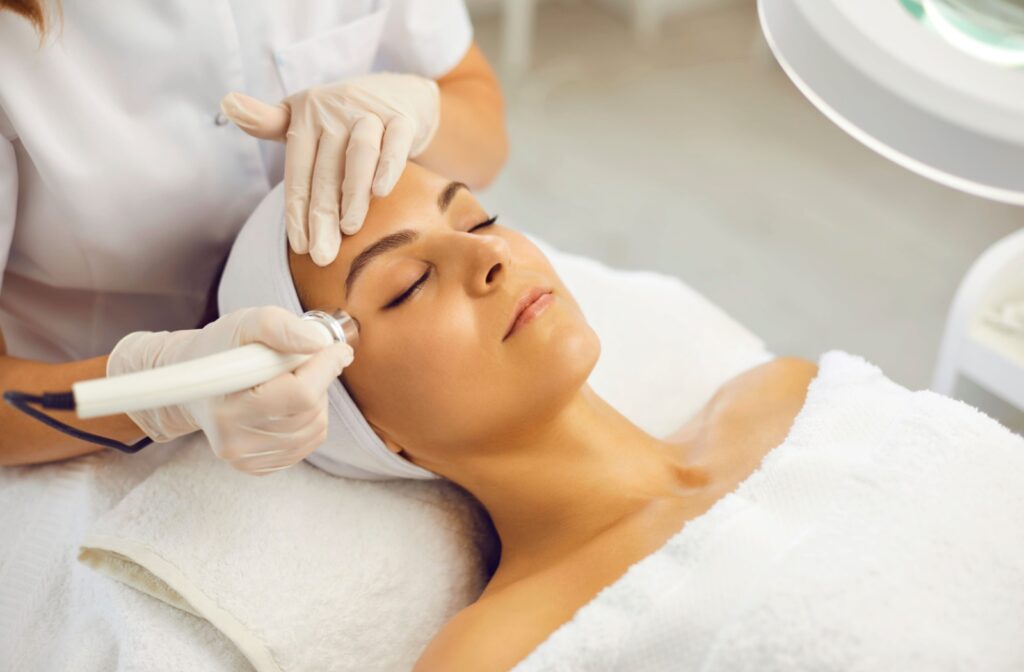 Patient receiving TempSure EyeEnvi treatment for under-eye wrinkles at a clinic in Omaha, NE.